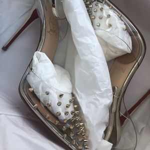 Christian Louboutin gold pumps